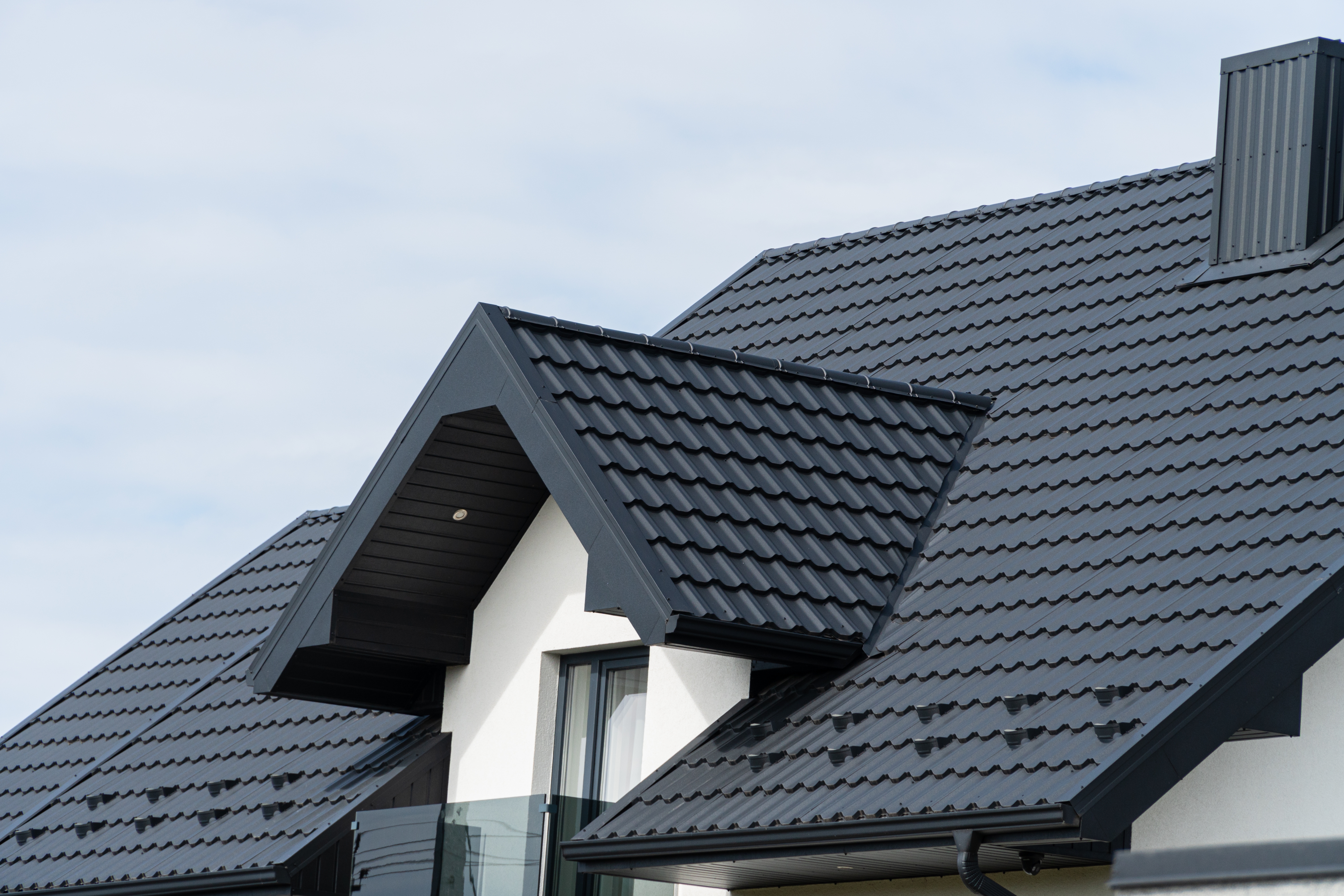 Home with a dark tile roof