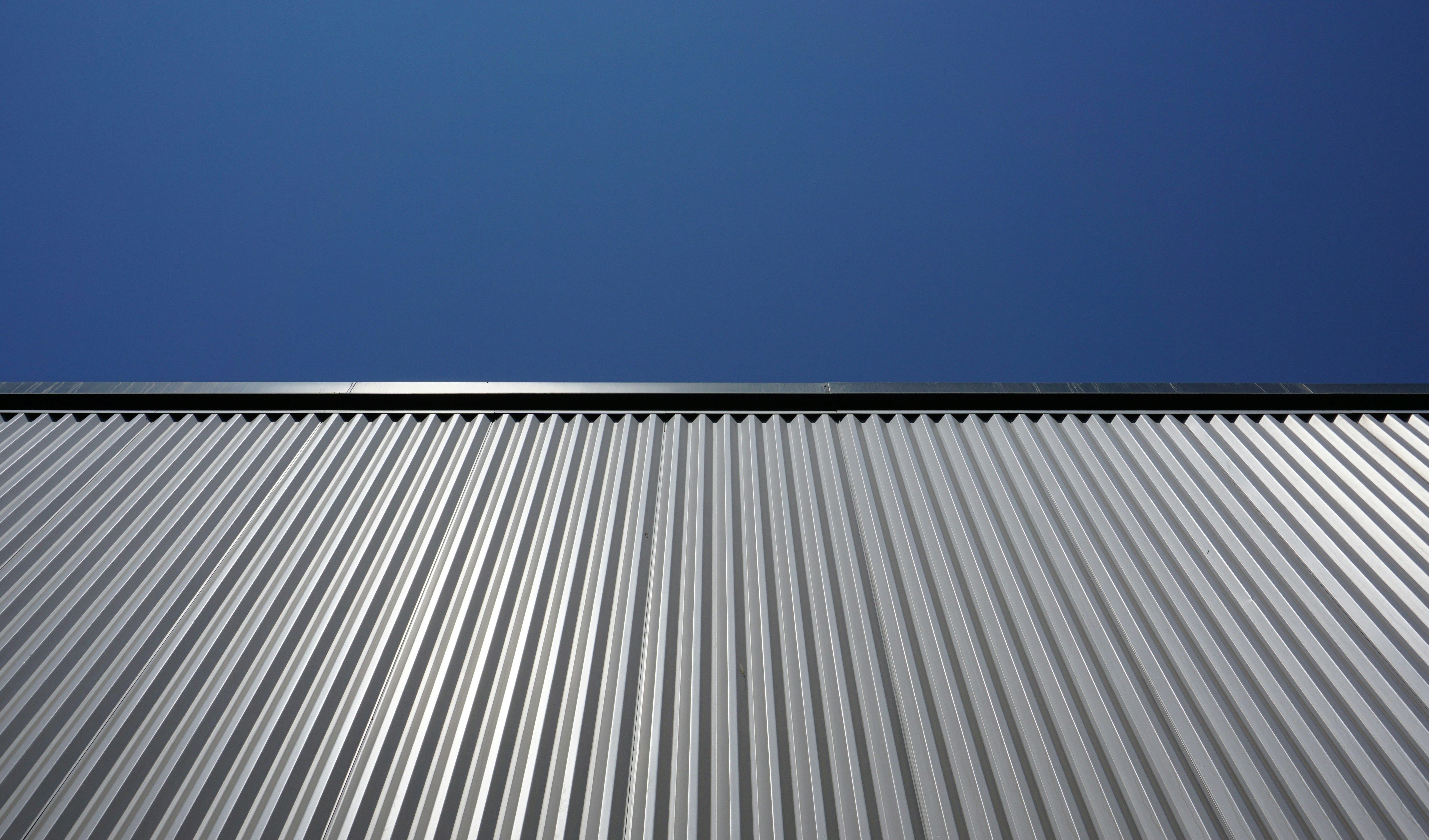 Reflective metal roofing that bounces sunlight away to keep a home cooler and cut energy bills