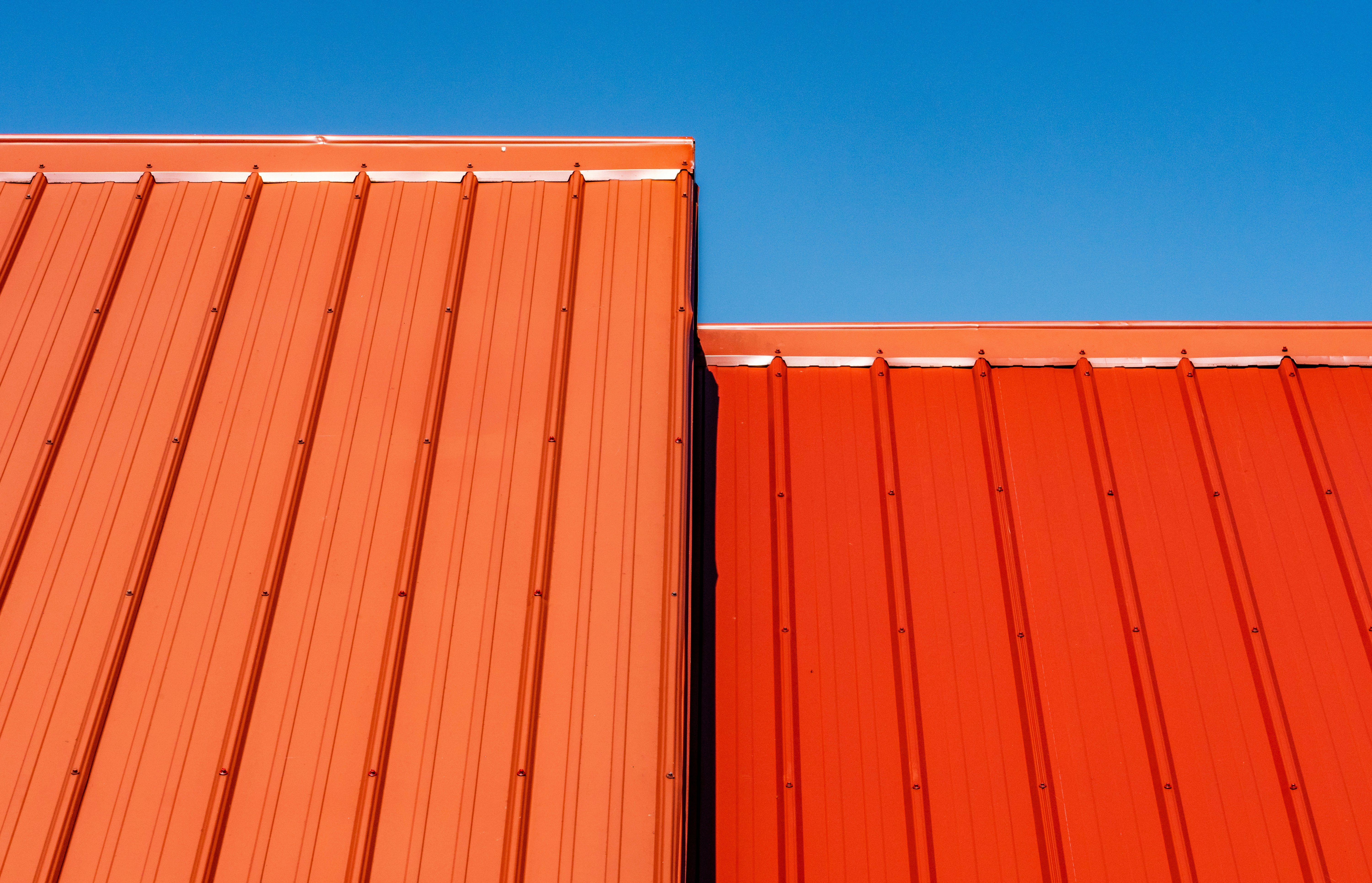 Standing seam metal roof against a blue sky